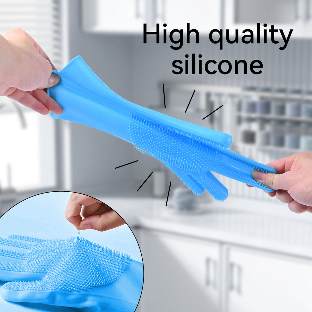 A pair of light blue silicone cleaning gloves with textured scrubbing sides, being held by two hands. The background is a blurred kitchen setting, and an inset circle shows a close-up of the scrubbing texture.